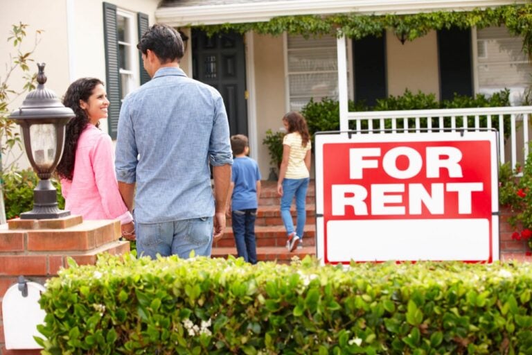 house with family and For Rent sign